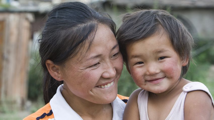 A Mongolian family in Tarialan, Mongolia who cultivates potatoes in their yard. 